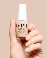 Hand holding OPI GelColor Berlin There, Doin' That gel nail polish with matching manicured nails