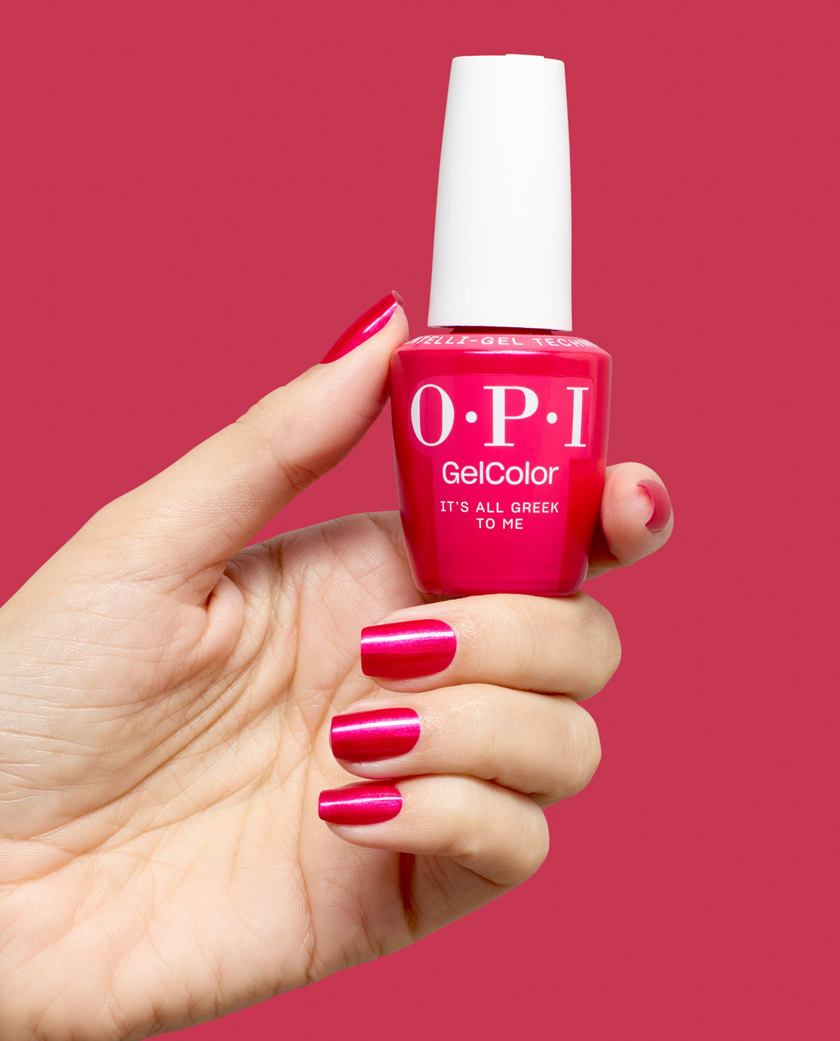 Hand holding OPI It's All Greek to Me gel polish bottle
