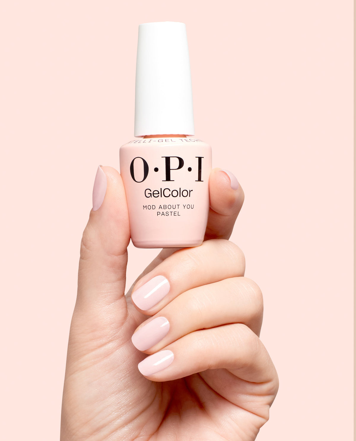 Hand holding OPI Mod About You Pastel gel polish bottle