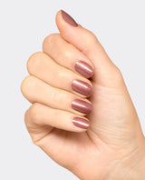 Hand displays a glossy manicure in Route Beer Float gel nail polish