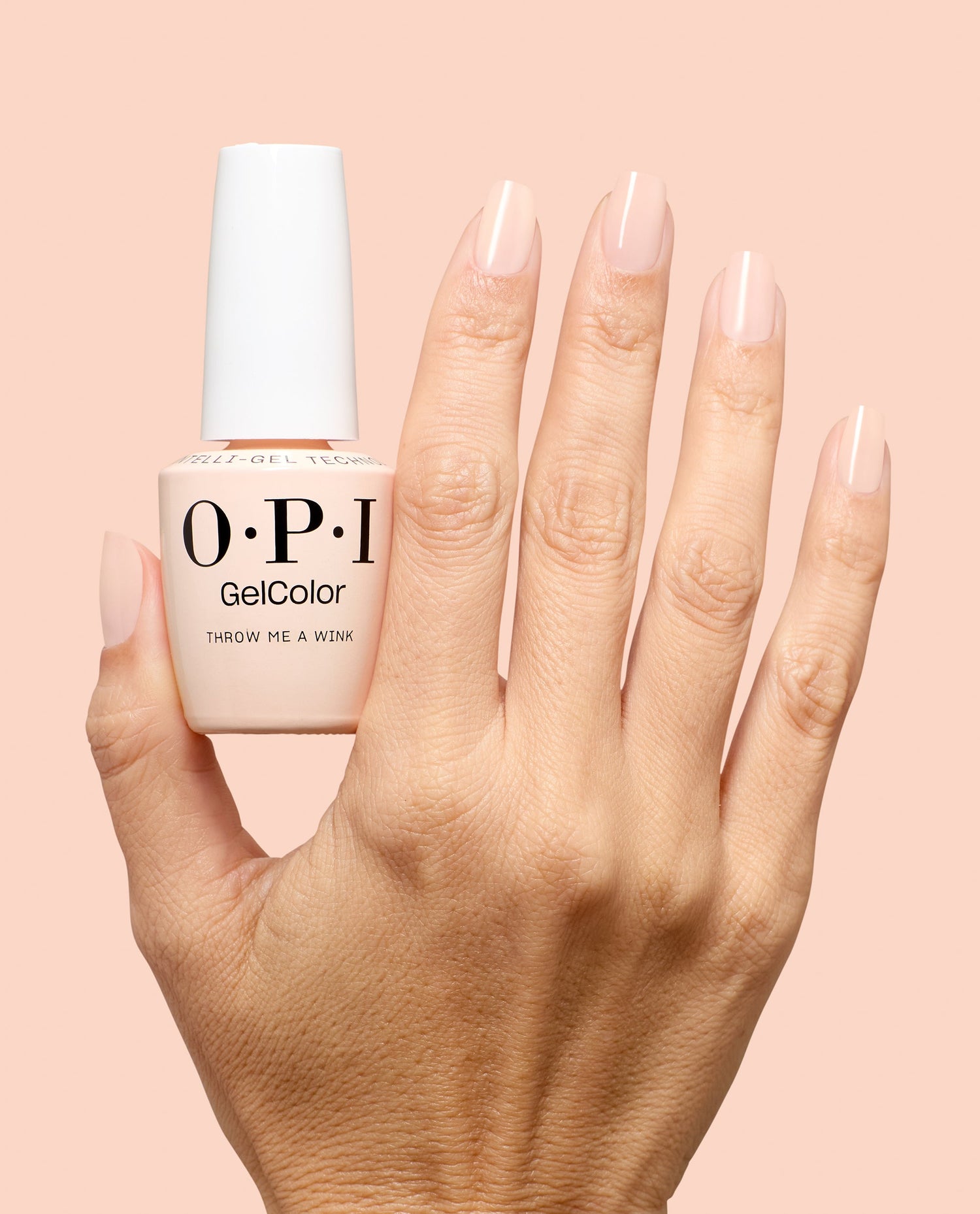 OPI GelColor Throw Me a Wink pale nude-pink gel nail polish shown on glossy manicured nails beside the bottle