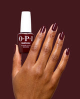 Hand holding OPI Vampire State Building gel polish bottle